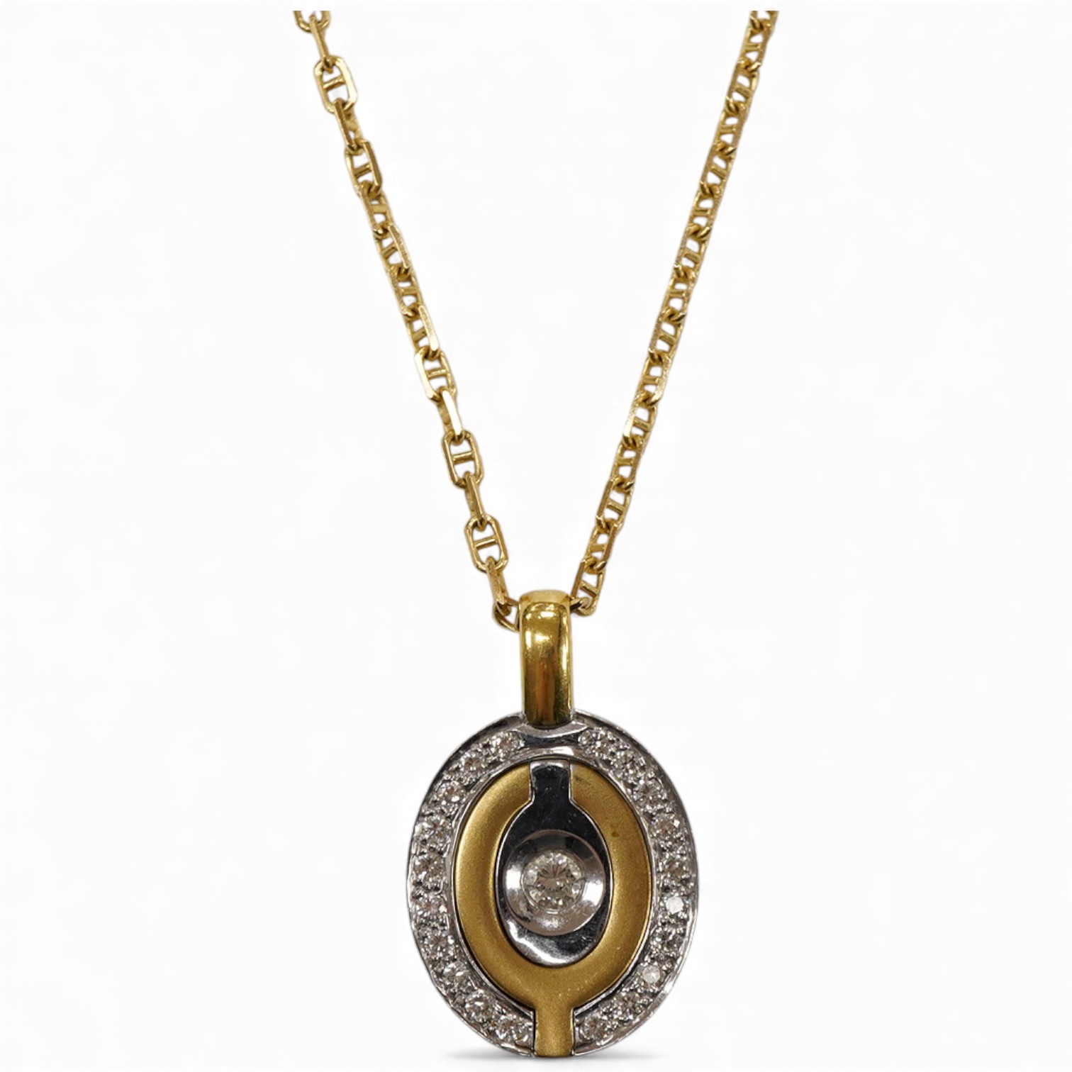 A yellow and white metal metamorphic oval pendant, with central diamond and diamond set border, closed 22mm, open 48mm, on an Italian 750 chain, 58cm, gross weight 16 grams.